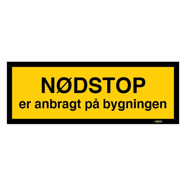 Nødstop er anbragt på bygningen. Bygningsskilt