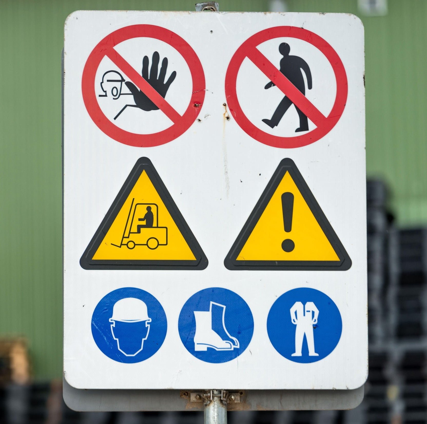 Signs warn of job security. Sign 'dangerous cargo'.